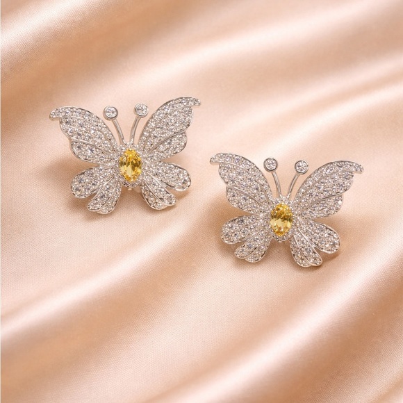 This is an elegant sterling silver plated butterfly dangle  Royale Elegant Butterfly Crystal Silver Diamond Earrings
